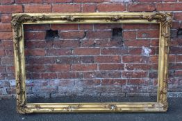 A 19TH CENTURY GILT RECTANGULAR FRAME, with floral detail and acanthus moulded detail, rebate 71 x