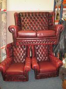 A VINTAGE OXBLOOD CHESTERFIELD STYLE THREE PIECE SUITE