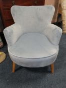 A MODERN UPHOLSTERED ARMCHAIR