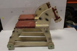 TWO VINTAGE WOODEN RIDE ALONG TOY HORSES