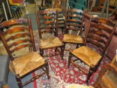 A SET OF FOUR OAK WICKERSEAT DINING CHAIRS