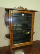 AN OAK GLAZED WALL HANGING CABINET W-54 CM