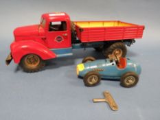 AN ELECTRIC TINPLATE GAMA TRUCK TOGETHER WITH A TIN PLATE SCHUCO GRAND PRIX RACER WITH KEY