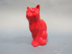 A RED GLAZED CAT MARKED TO THE BASE ROYAL DOULTON SAMPLE