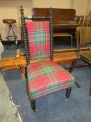 AN ANTIQUE EBONISED BOBBIN TURNED BEDROOM CHAIR WITH MODERN UPHOLSTERY