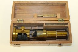AN ANTIQUE STUDENTS MICROSCOPE WITH SLIDE & TWEEZERS