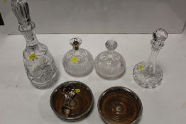 A PAIR OF SILVER PLATED BOTTLE COASTERS TOGETHER WITH A SELECTION OF CUT GLASS DECANTERS ETC