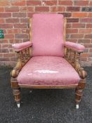 A 19TH CENTURY MAHOGANY FRAMED OPEN GENTLEMANS ARMCHAIR, with carved detail, with original ceramic