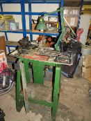 A SMALL METAL WORKING LATHE ON METAL STAND