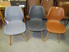 A MODERN HARLEQUIN SET OF THREE CHAIRS