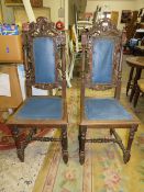 A PAIR OF CARVED OAK JACOBEAN STYLE CHAIRS