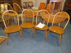 A SET OF FOUR ERCOL WINDSOR CHAIRS