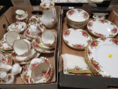 TWO TRAYS OF ROYAL ALBERT OLD COUNTRY ROSES TEA AND DINNERWARE TO INCLUDE A COFFEE POT, CUPS &