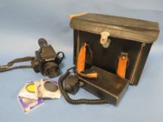 A MAMIYA 645E CAMERA WITH QUANTAM TURBO BATTERY AND SOME FILTERS IN A CASE