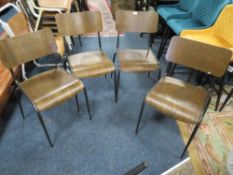 A SET OF FOUR INDUSTRIAL STYLE STACKING DINING CHAIRS