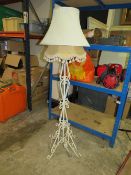 A VINTAGE WROUGHT IRON FLOORSTANDING LAMP