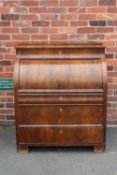 A 19TH CENTURY BIEDERMEIER STYLE MAHOGANY CYLINDER BUREAU HAVING A FITTED INTERIOR, the pull-out