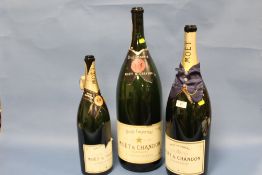 A COLLECTION OF THREE ASSORTED SIZE EMPTY CHAMPAGNE DISPLAY / ADVERTISING BOTTLES
