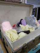 A LARGE PACKING TRUNK AND CONTENTS COMPRISING TEXTILES, FABRIC PANELS. WOOL ETC