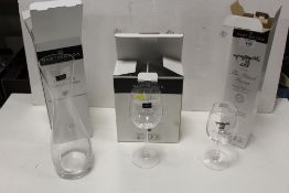 THREE BOXED DARTINGTON CRYSTAL GLASSWARE ITEMS TO INCLUDE A DECANTER AND WINE GLASSES