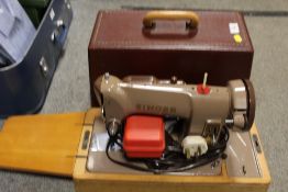 A CASED SINGER SEWING MACHINE