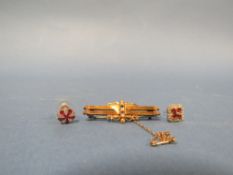 A GEMSET BAR BROOCH WITH INDISTINCT HALLMARKS TOGETHER WITH TWO ODD GEMSET EARRINGS