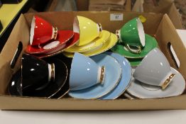 A SET OF SIX HARLEQUIN TRIOS/ TEAWARE BY SHERIDAN BONE CHINA ENGLAND