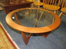 A G-PLAN RETRO TEAK GLASS TOPPED COFFEE TABLE - DIA. 84 CM