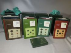 FOUR EMBOSSED VOLUMES OF THE COIN SETS OF ALL NATIONS CONTAINING 'FRESH SETS OF CIRCULATING