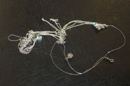 A QUANTITY OF SILVER NECKLACES