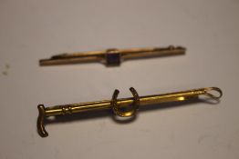A 9CT GOLD BAR BROOCH TOGETHER WITH A YELLOW METAL BAR BROOCH
