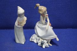 TWO LLADRO FIGURINES INCLUDING A GIRL HOLDING A TELEPHONE WITH A PUPPY