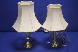 A PAIR OF BRASS TABLE LAMPS
