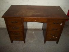 AN OAK TWIN PEDESTAL DESK