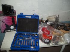 A PACKAGE COMPRESSED AIR SPRAY GUN KIT, A BOXED OIL FLUID EXTRACTOR, A CASED HALF INCH SOCKET SET,