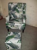 A MODERN WINGED FIRESIDE CHAIR AND POUFEE