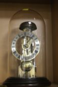 A DOME CASED MANTLE CLOCK