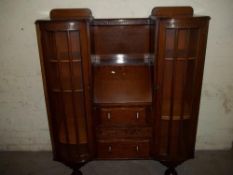 AN OAK LADIES WRITING BUREAU FLANKED BY 2 BOOKCASES