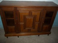 AN OAK MODIFIED SIDEBOARD CUPBOARD