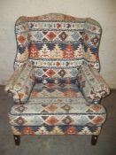 A WING BACK FIRESIDE CHAIR