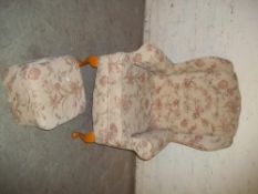 A MODERN FIRESIDE CHAIR AND A POUEFFE