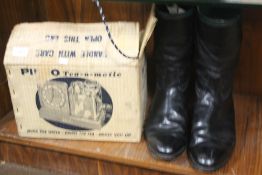 A VINTAGE PIFCO TEA-O-MATIC TOGETHER WITH A PAIR OF RIDING BOOTS