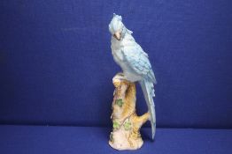 A CERAMIC FIGURE OF A COCKATOO