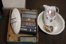 A TRAY OF BOOKS AND A JUG AND BOWL SET (TRAY NOT INCLUDED)