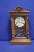AN OAK CASED MANTLE CLOCK