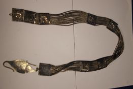 AN ANTIQUE ORIENTAL WHITE METAL BELT, WOVEN STRANDS WITH SLIDING PANELS W APPROX 270 GR