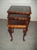 A SOLID MAHOGANY NEST OF 3 TABLES
