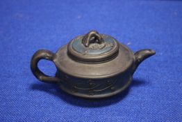 AN ORIENTAL TYPE TEAPOT