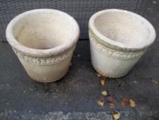 A PAIR OF LARGE CONCRETE GARDEN PLANTERS