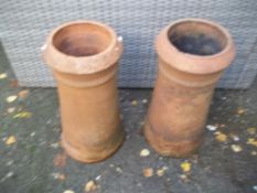 A PAIR OF TERRACOTTA CHIMNEY POT PLANTERS